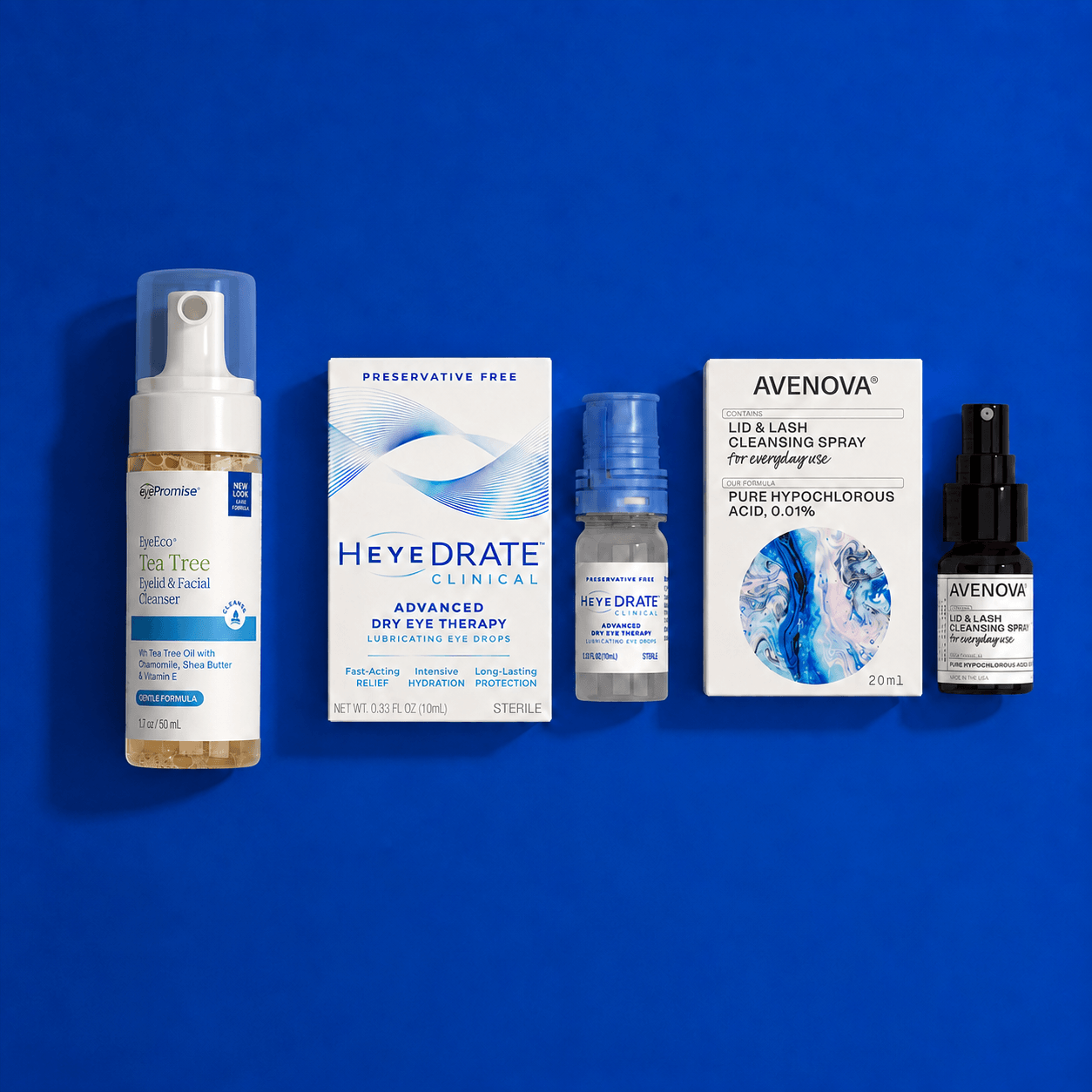 Three eye care products arranged on a blue background: an EyePromise tea tree eye cleanser bottle, a Heyedrate Clinical dry eye box with bottle and an Avenova Lid and Lash cleansing spray box with bottle.