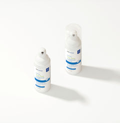 Two EyePromise Tea Tree Cleanser bottles on a white background