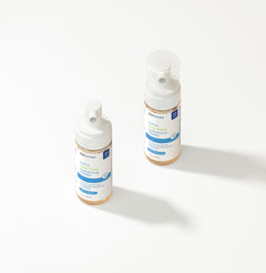 Two EyePromise Tea Tree Cleanser bottles on a white background