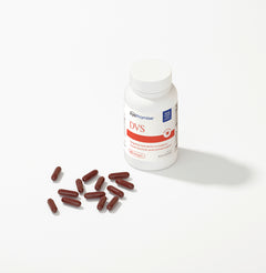 Bottle of EyePromise DVS supplements with capsules on a white background