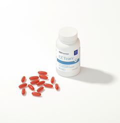 Bottle of EZ Tears eye supplement with red capsules on a white background